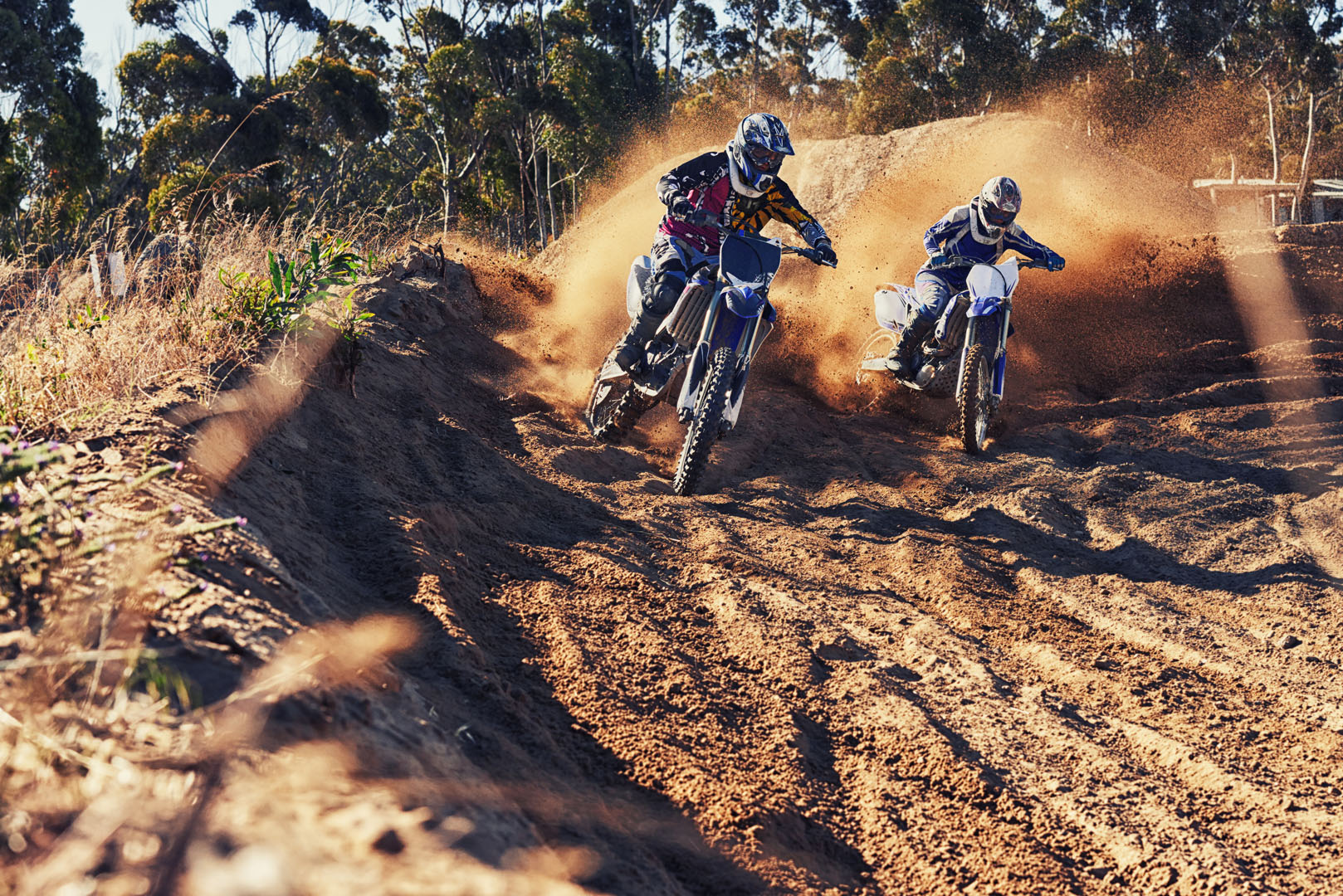 Time to rip up this track. Shot of two motocross racers in actio