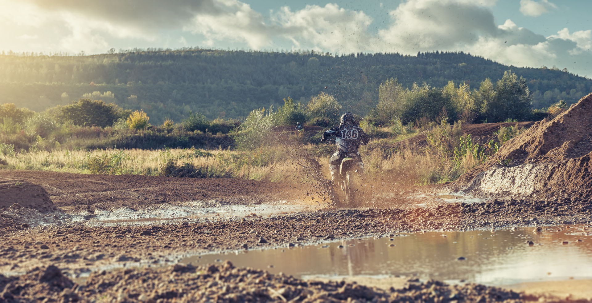 Extreme Motocross MX Rider riding on dirt track